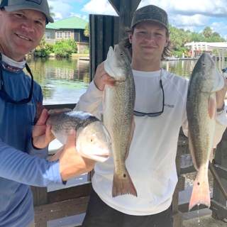 Father and son anglers have a successful day on the water