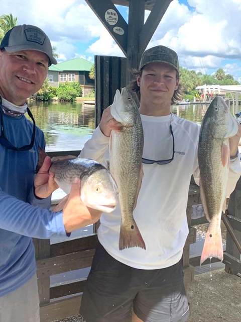 Father and son anglers have a successful day on the water